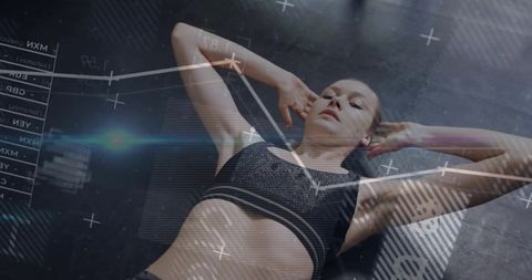 Female athlete performing core workout on mat with futuristic hud overlay