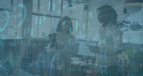 Diverse Innovators Analyzing Financial Data in Modern Office