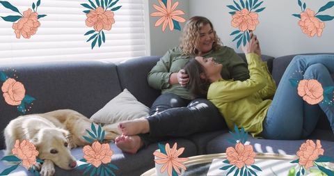 Happy Lesbian Couple Relaxing on Couch with Dog and Smartphone - Download Free Stock Images Pikwizard.com