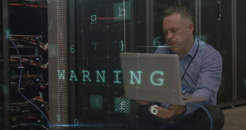Technician Evaluating Server Bay with Digital Warning Display