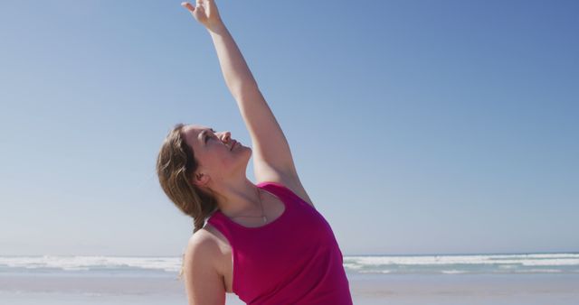 Woman Stretching at Beach on Sunny Day - Download Free Stock Images Pikwizard.com