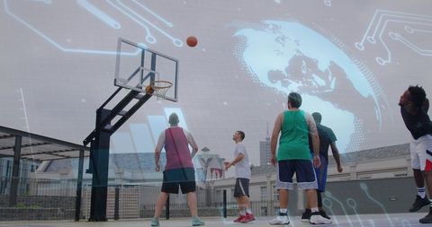 Playing rooftop basketball with digital globe and circuit overlay, team shooting hoop