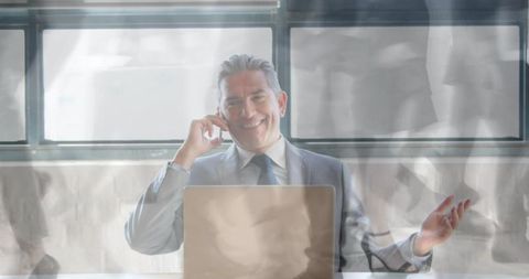 Business Executive Communicating on Phone in Modern Office