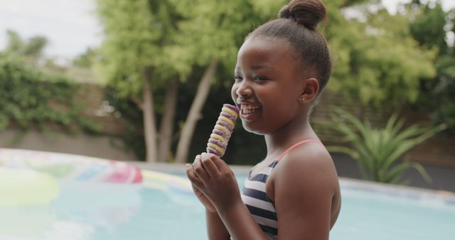 Smiling African American Girl Enjoying Ice Cream by Pool - Download Free Stock Images Pikwizard.com