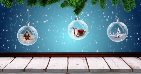 Festive Baubles Hanging Amidst Falling Snowflakes - Download Free Stock Images Pikwizard.com