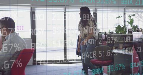 Creative Team Working with Financial Data Overlay in Modern Office