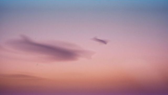 Dreamy wispy clouds in pastel twilight sky