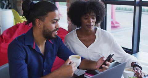 Diverse Couple Relaxing in Cafe with Coffee and Technology - Download Free Stock Images Pikwizard.com