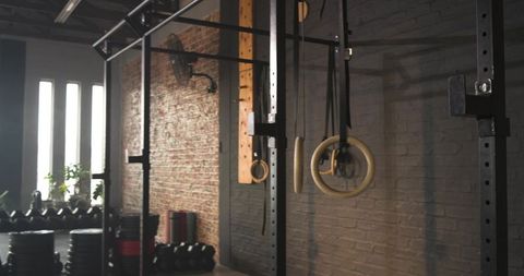 CrossFit Gym with Wooden Rings and Dumbbells Interior
