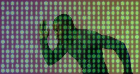 Sprinter assuming starting stance under neon green grid overlay, dynamic motion