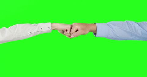 Business Team Fist Bump on Vibrant Green Background - Download Free Stock Images Pikwizard.com