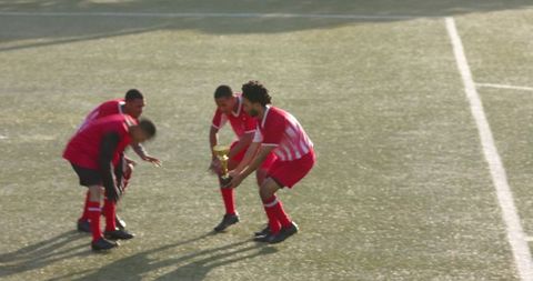 Soccer Team Celebrating Victory With Trophy on Field - Download Free Stock Images Pikwizard.com