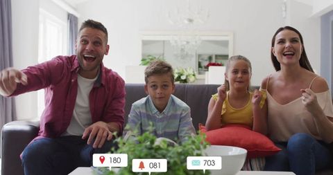 Happy family sharing moments of joy on sofa at home