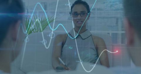 Businesswoman Taking Notes During Analytical Meeting