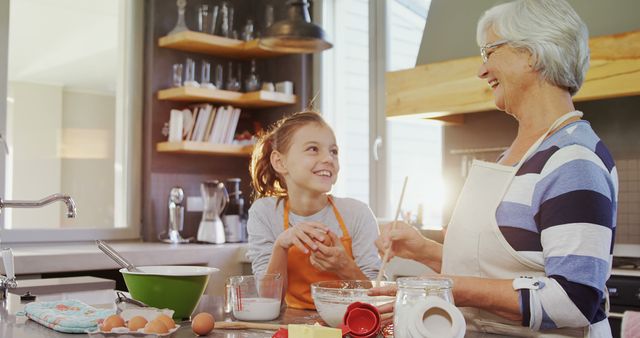 Grandmother Baking with Granddaughter in Kitchen - Download Free Stock Images Pikwizard.com