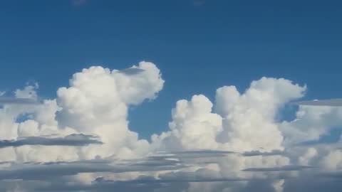 Time-Lapse of Receding Cumulus Clouds in Clear Blue Sky