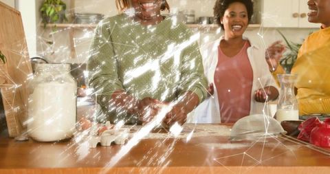Friends Baking Together Kneading Dough on Kitchen Island Flour Jar Eggs Laughter