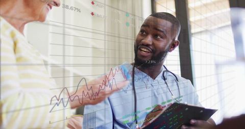 Doctor consulting patient with graphical data overlay in hospital