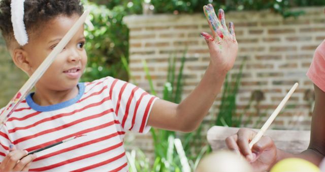 Child with Face Paint Playing and Smiling Outdoors - Download Free Stock Images Pikwizard.com