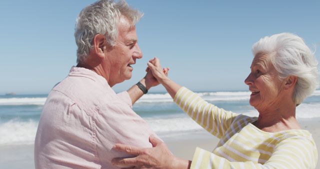 Senior Couple Dancing and Smiling on Beach - Download Free Stock Images Pikwizard.com