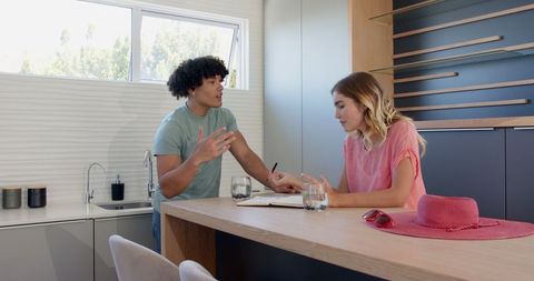 Young couple planning together in modern kitchen