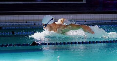 Determined Male Swimmer Performing Butterfly Stroke in Pool - Download Free Stock Images Pikwizard.com