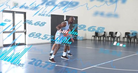 Dribbling guard driving past defender on indoor court with futuristic sports data overlays