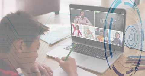 Student joining virtual classroom on laptop while taking notes, remote learning at home