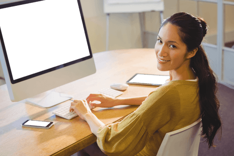 Transparent Isolated Businesswoman Smiling at Desk with Digital Devices - Download Free Stock Videos Pikwizard.com