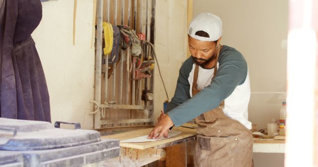 Carpenter Measuring Wood with Precision in Workshop - Download Free Stock Images Pikwizard.com