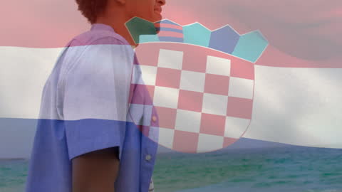 Youth Dreaming at Beach with Croatian Flag
