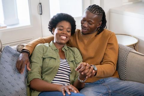 Happy couple sharing intimate moment at home