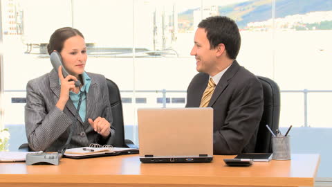 Business Colleagues Conversing in Modern Office Environment