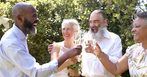 Seniors Celebrating Outdoor Wedding with Champagne Toast