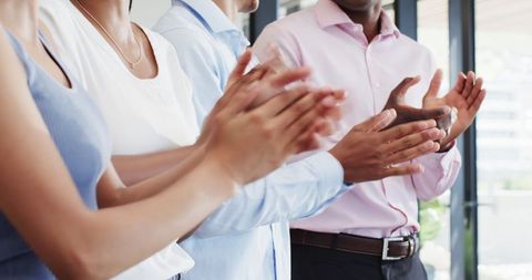 Diverse Business Professionals Applauding in Office Environment