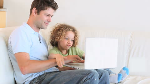 Father and Son Bonding with Laptop Learning Together