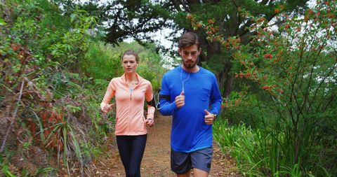 Couple enjoying a forest run for fitness