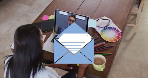 Woman Having Online Video Call with Email Overlay Symbolizing Communication