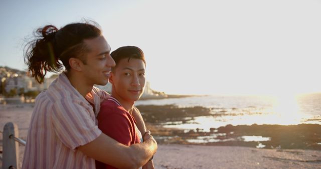 Affectionate Couple Embracing During Sunset Beach Walk - Download Free Stock Images Pikwizard.com