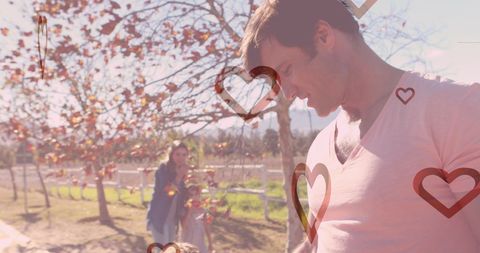 Joyful Family Outdoors with Heart Graphics and Fall Colors