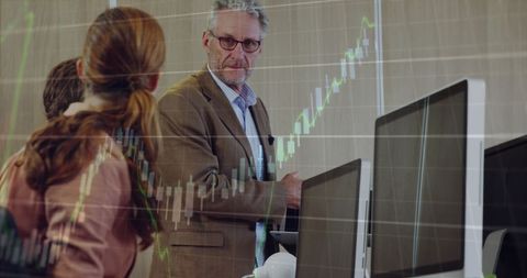 Financial Analysts Discussing Market Trends in Modern Office