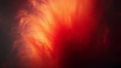 Macro slow-motion orange fibrous plume glowing and drifting outward over dark core