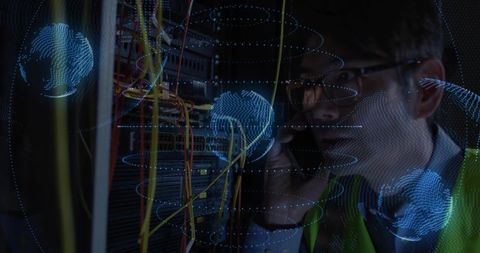 It technician troubleshooting server rack with smartphone and holographic network globes
