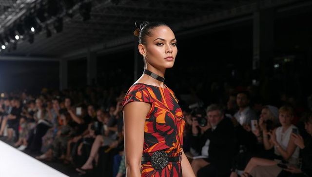 Model Walking Runway Show with Wearing Floral Dress and Accessories