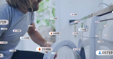 Man loading front-load washer with smart notification overlays and iot interface