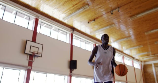 Athletic Basketball Player Practicing in Indoor Court - Download Free Stock Images Pikwizard.com