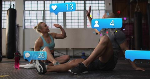 High-fiving Fitness Partners Taking Gym Break With Social Media Like and Comment Overlays