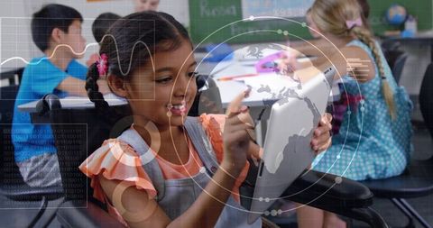 Inclusive classroom student using tablet with stylus, interactive globe and data overlay
