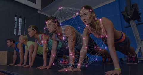 Group holding plank in gym with smartwatch fitness trackers and social network overlay