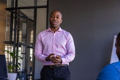 Business Professional Presenting in Modern Office Atmosphere